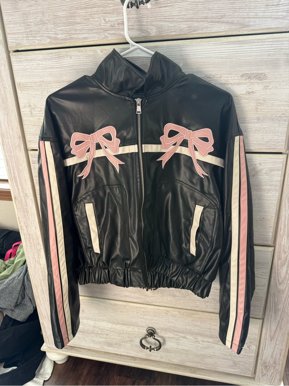 Women's Black Faux Leather Zip Jacket with Pink Bow Accents